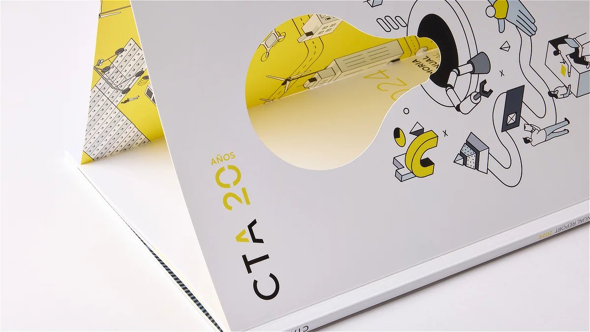 Portada de la memoria anual de CTA con diseño ilustrado en amarillo y blanco, encuadernación cuidada y troquel central que deja ver ilustraciones interiores del informe.